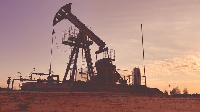 Extraction of petroleum. Oil Pump Jack on blue. Oil Field. Petrolium crude Industrial. Crude pump jack working.. Extraction of petroleum in oilfield. Crude petroleum industry