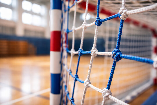 Close-up of a handball goal with blue and red details