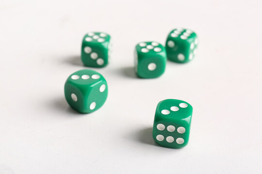 Green dices on light background