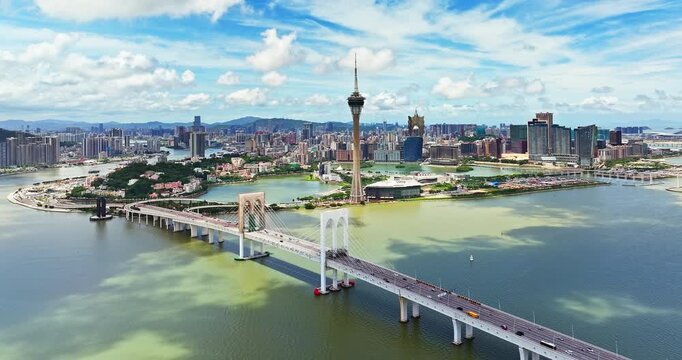 Aerial view of Macau Tower and Sai Van Bridge against the city skyline, Macau, China
