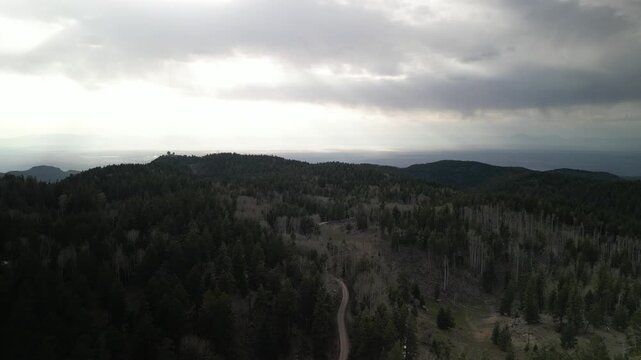Aerial dirt road in Lincoln National Forest Cloudcroft New Mexico stormy spring day