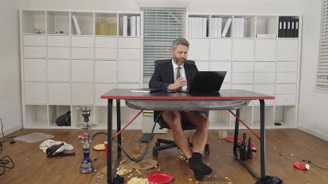 Funny freelancer. Crazy businessman in jacket and shorts on funny business meeting. Crazy funny business man freelancer on business meeting in mess. Funny workday. Free business.