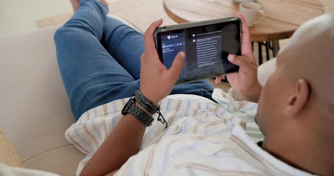 African American man reclining on sofa, striped shirt tapping left menu scrolling split app reading