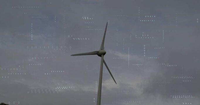 Vertical video: Rotating 3-blade turbine spinning in cloudy sky, driven by breeze, with dot overlay