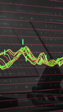 Vertical video: Incoming data driving finance chart updating on glossy screen, cyan markers popping