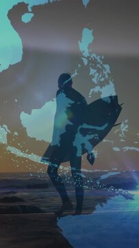 Surfer with board stepping sand, globe overlay appearing, rotating, sparks sweeping to waves travel
