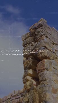 Vertical video: Camera panning left showing ruined columns waveform pulsing bars rising framing sky