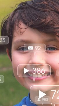 Vertical video: Boy moving into frame in park, play or mail icons covering smile, showing social rea