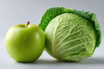 Fototapeta premium Green apple and cabbage, fresh produce on gray background, close up of green fruit and vegetable
