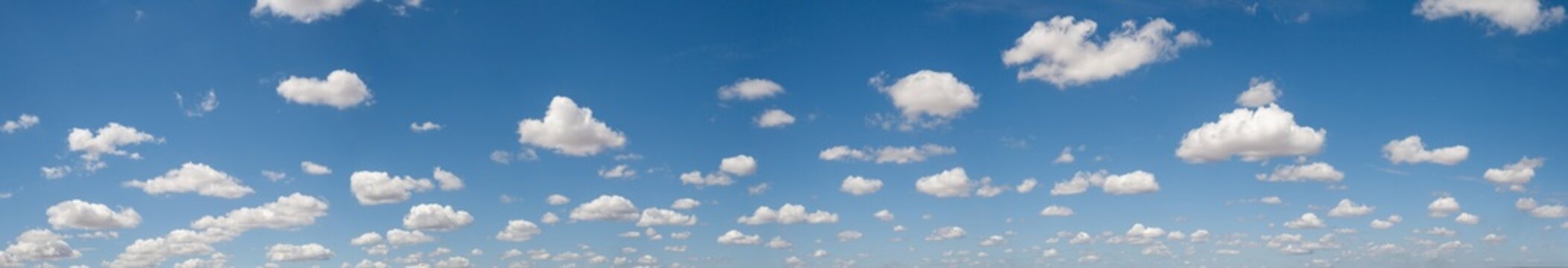 Wide Panorama Sky Replacement with Scattered White Cumulus Clouds horizon in a clear atmosphere