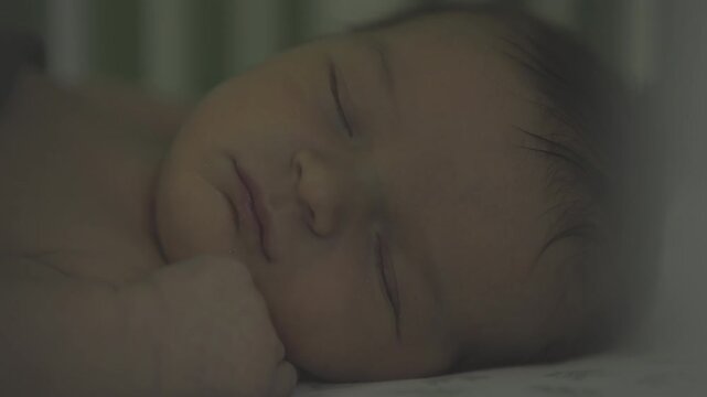 Baby asleep in crib at night 4k