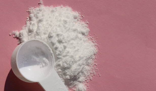 White creatine powder used as a pre-workout performance booster.