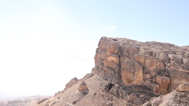aerial drone shot of the historic Christian village of Ma'aloula, built into the rocky mountainside