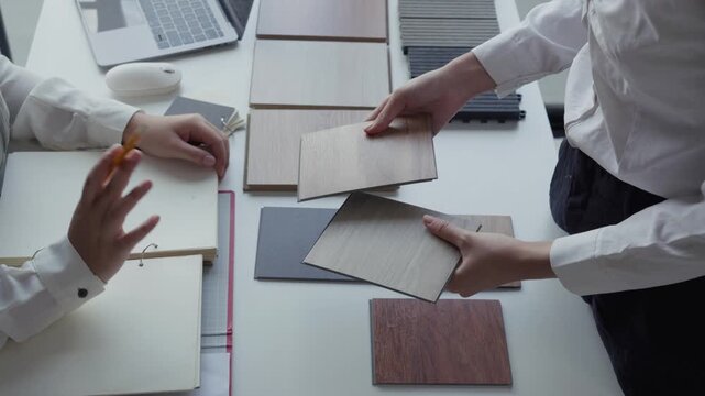 Two Interior Designers Collaborating in Office