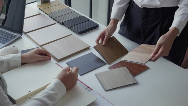 Two Interior Designers Collaborating in Office