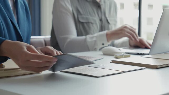 Two Interior Designers Collaborating in Office