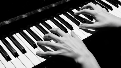 Pianist hands playing black and white keys