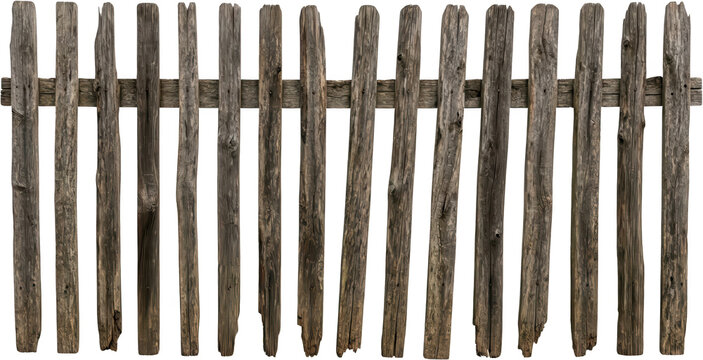 Close up of an old weathered wooden picket fence made of vertical planks with horizontal supports showing natural texture and decay wooden fence old fence rustic wood grain