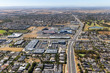 Fototapeta premium Craigieburn aerial view of commercial district, roads and residential area, Victoria Australia