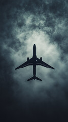 Fototapeta premium Passenger airplane silhouette soaring in a dark storm cloud