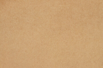 Fototapeta premium Brown cardboard sheet abstract background, texture of sepia color kraft paper with vintage pattern for design art work.