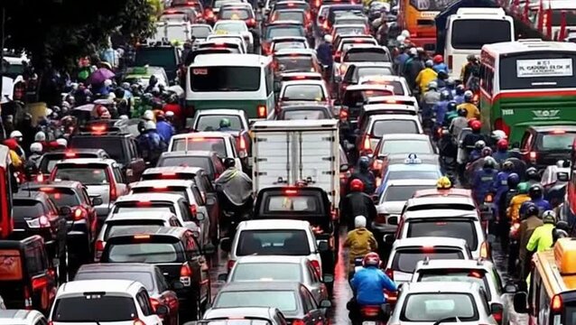 Heavy traffic congestion in a crowded urban city street with cars and motorcycles stuck bumper to bumper under harsh midday sunlight. Realistic city transportation problem, pollution, commuting, and r