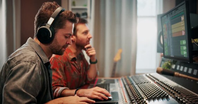 Production, music and producers with headphones in studio working on album or song with computer. DJ, equipment and male sound technicians with technology for mixing audio track in recording booth.
