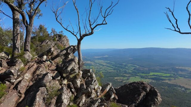 Sweeping views of the Razorback ridge line stretch across the horizon, with valleys below and dramatic skies creating a breathtaking mountain landscape.