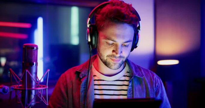 Mic, man and reading with tablet for broadcast, talk show and script for podcast. Media agency, content creation and male person with tech for live streaming, studio recording or audio hosting