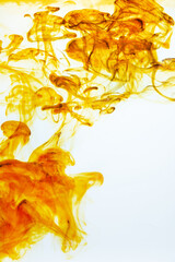 Iodine antiseptic drop dispersing in water, creating abstract patterns. Healthcare, disinfection, and medical treatment concept.