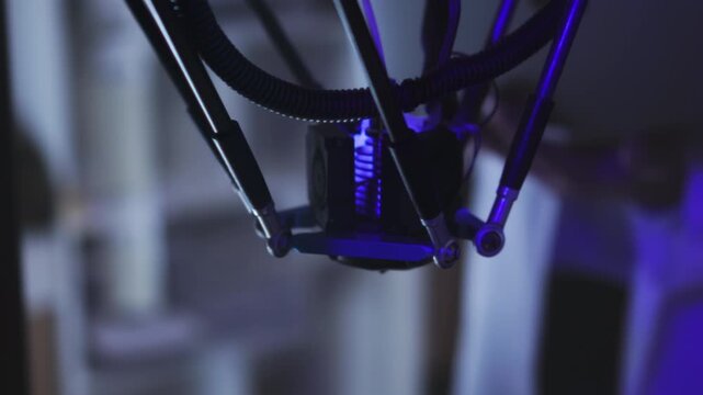 Advanced robotic system operating precisely in sterile lab environment under vibrant purple illumination