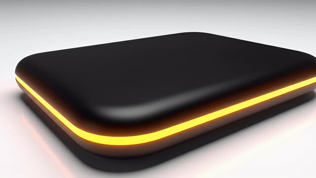 A sleek, black and orange external hard drive rests on a white surface, showcasing a modern design and minimalist aesthetic.