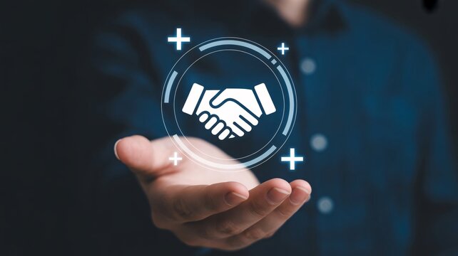 Business partnership handshake, cooperation and agreement concept, hand holding digital icon