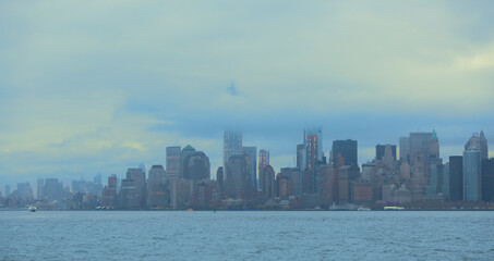 Obraz premium Moody Lower Manhattan Skyline in Misty Clouds with Copy Space