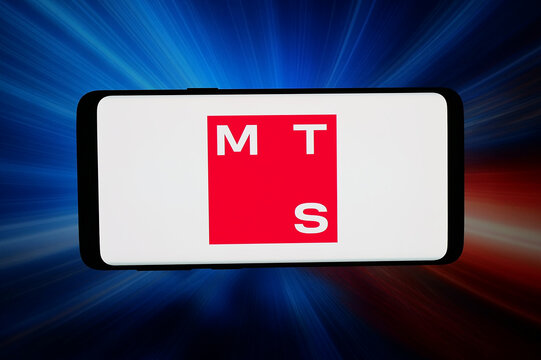 Stuttgart, Germany - 03-31-2026: In this photo illustration, the logo of Russian company Mobile TeleSystems PJSC (MTS) is displayed on a smartphone in front of abstract background on computer screen.