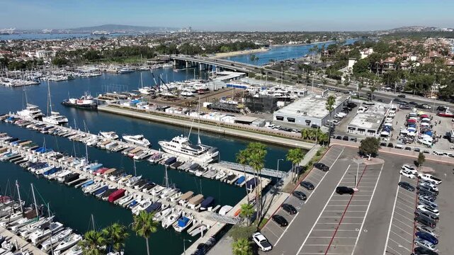 High-angle aerial view of Marina Pacifica and Naples area in Long Beach, California, showing marina docks filled with boats and waterfront homes near 2nd Street.
