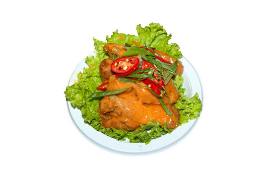 Crispy fried chicken wings with spicy mentai sauce and chili sprinkles, isolated on transparent background