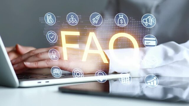 Hands typing on a laptop with icons around the letters and the word FAQ displayed on a screen.