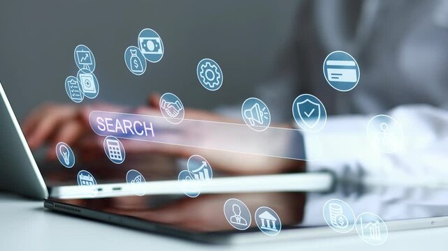 Hands typing on a laptop with search icons floating over the screen during a work session in an office environment.