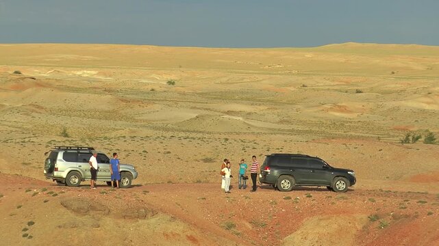 Mongolia, Sainshand - July 29, 2015: Tourists in the Gobi desert on a bright Sunny evening.
 