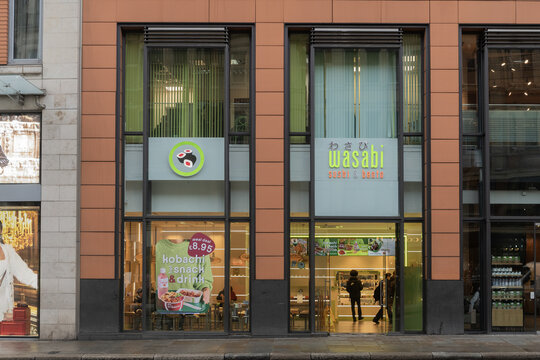 Wasabi sushi and bento restaurant storefront with large glass windows