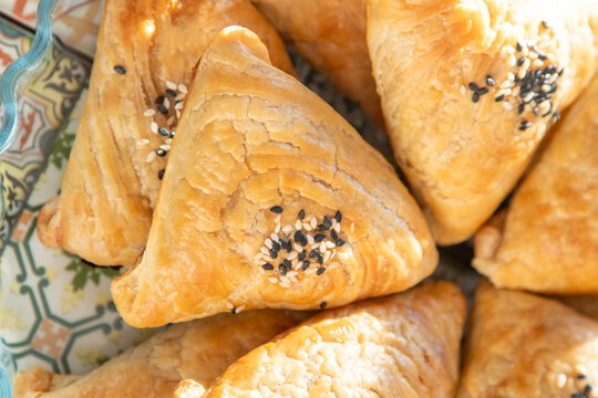 Traditional Arabic pies Mutabbaq. Pastry from dough. Food in a bowl on the table top view