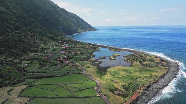 Scenic aerial of Faja da Cumbre, Sao Jorge, Azores with ocean and greenery