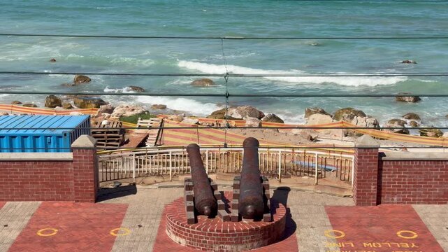 Canons facing the beach at a beach in Muizenberg, Cape Town.