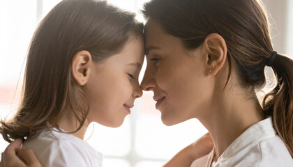 Naklejka premium Intimate and emotional moment of a mother expressing love through a gentle kiss, symbolizing care and affection.