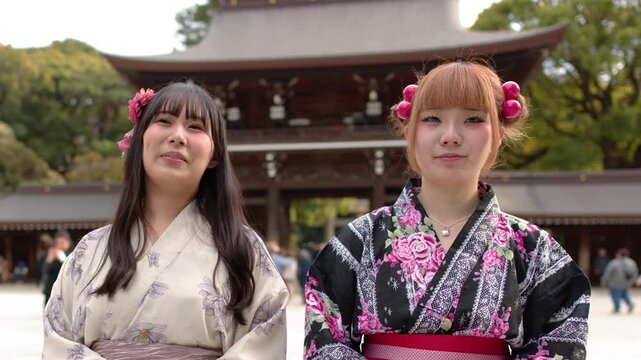 Two Japanese Women in Traditional Kimono Standing Before Meiji Jingu Shrine