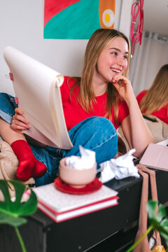 Smiling musician practicing piano with tablet in cozy home studio