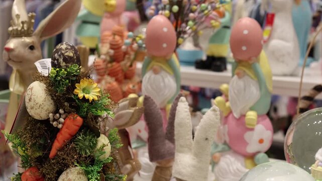 Vertical screen colorful easter decoration with rabbit eggs flowers and handmade ornaments arranged in festive composition creating warm spring holiday mood and cheerful atmosphere