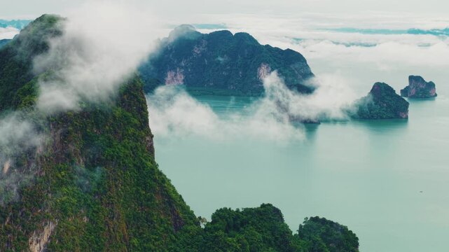 Aerial view Hong green lush tropical island and Phang Nga bay with fog, melancholic and mysterious landscape of nature Thailand.
