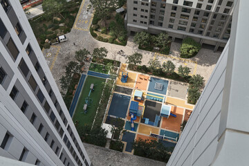 Aerial view down onto residential courtyard and playground © Namsun